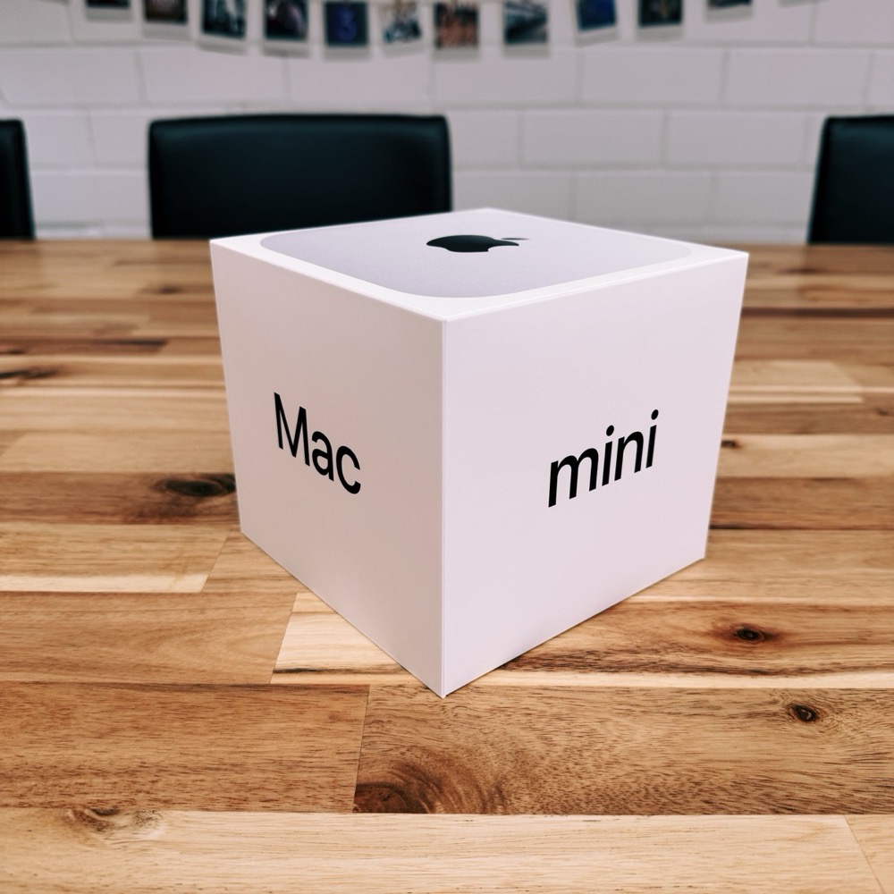 Mac Mini packaging on a table.